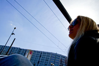 Low angle view of woman against sky