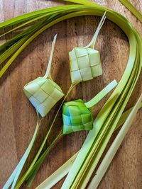 Ketupat is a dish made from rice or glutinous rice wrapped in coconut leaves and boiled in a pot