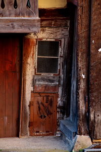 Old wooden door of abandoned house