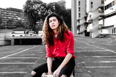 Portrait of teenage girl sitting outdoors