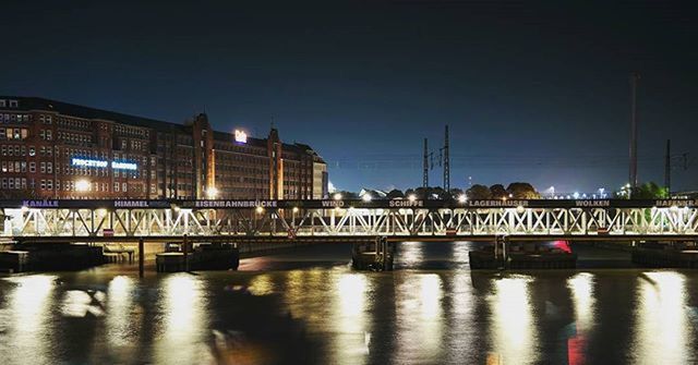 architecture, built structure, building exterior, illuminated, city, night, transportation, reflection, clear sky, water, bridge - man made structure, canal, connection, river, street light, waterfront, building, city life, street, sky