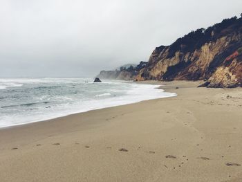 Scenic view of beach and sea against sky