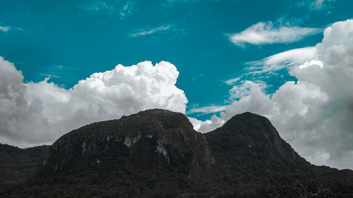 Low angle view of majestic mountain against sky