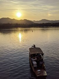 Scenic view of lake against sky during sunset