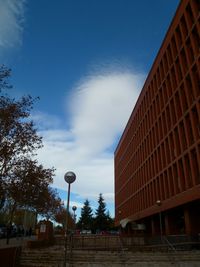 Low angle view of building against blue sky