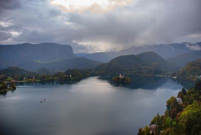 Scenic view of lake and mountains against sky