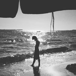Woman standing on beach