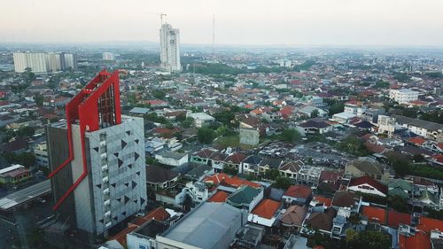 High angle view of city buildings against sky