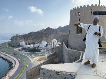 Rear view of man standing on road