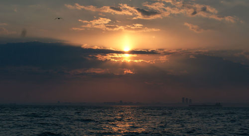 Scenic view of sea against sky during sunset