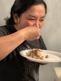 Portrait of man eating food