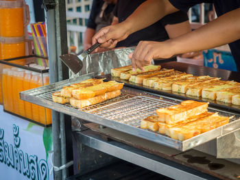 Close-up of grilled garlic bread for sale on chatuchak weekend market, bangkok, thailand