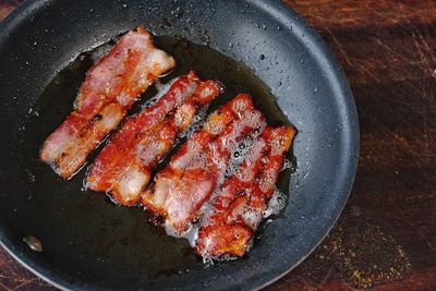 High angle view of meat on barbecue grill