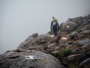 Woman standing on rock formation