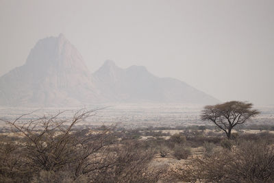 Scenic view of mountains in foggy weather