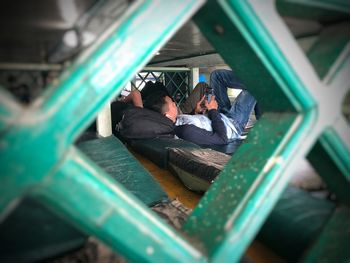 People relaxing in playground