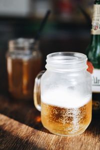 Beer in jar on table