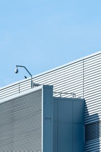 Low angle view of building against clear blue sky