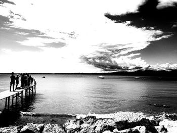 Scenic view of sea against cloudy sky