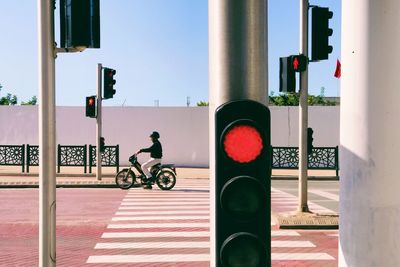 Man riding bicycle on street