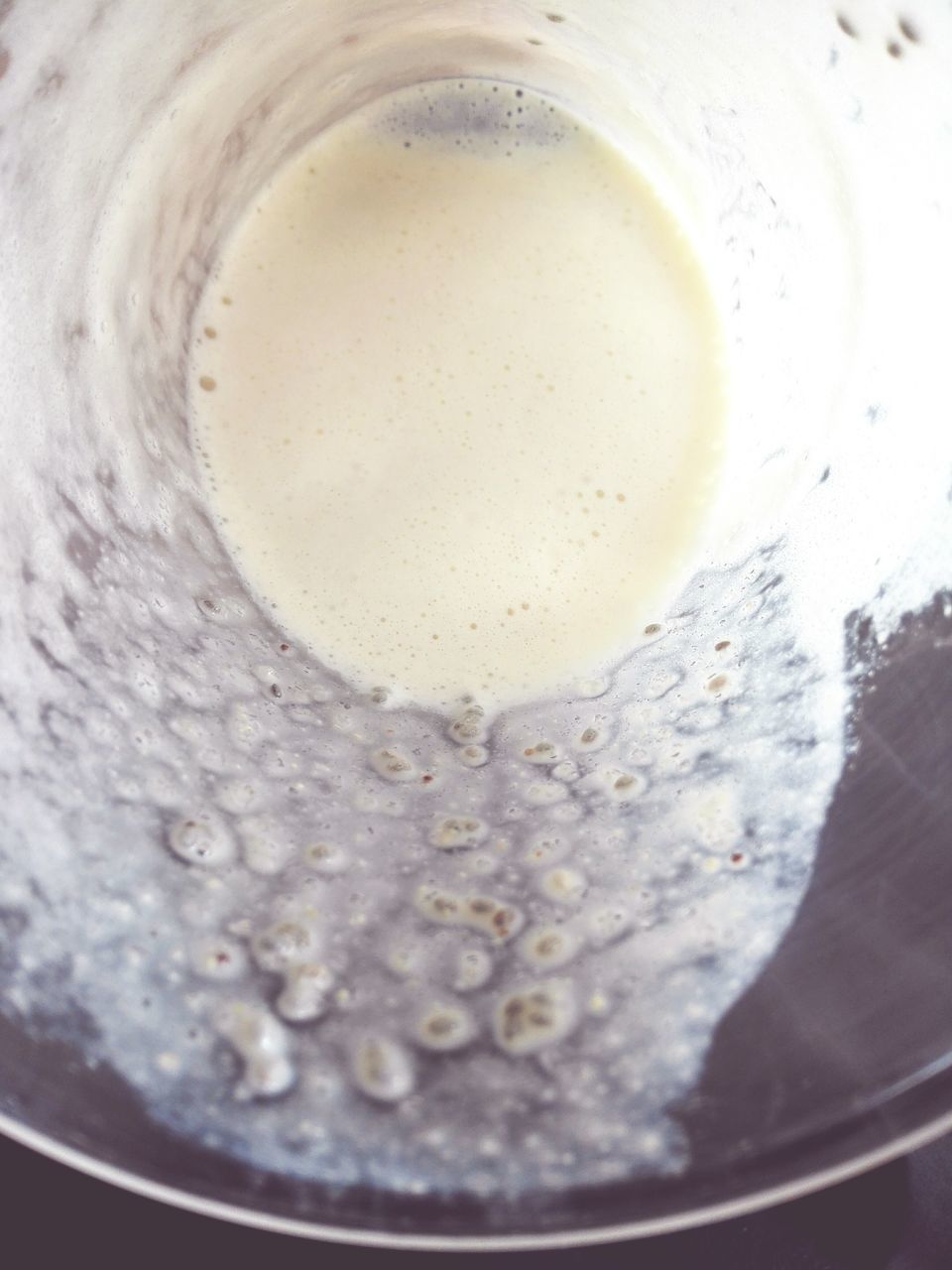 freshness, indoors, drink, refreshment, food and drink, close-up, water, still life, high angle view, drinking glass, glass - material, drop, transparent, table, liquid, cold temperature, no people, frothy drink, ice, bubble