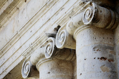 Low angle view of carvings on old building