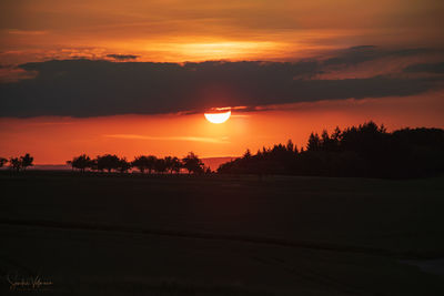 Scenic view of silhouette landscape against sky during sunset