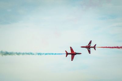 Low angle view of airplane flying in sky