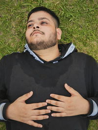 Portrait of young man standing outdoors