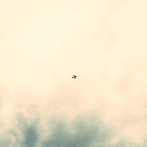 Low angle view of airplane flying in sky