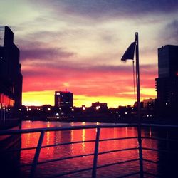 Silhouette of city at sunset