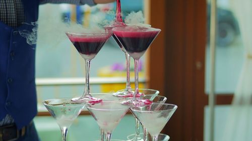 Cropped image of man pouring drink in wineglass