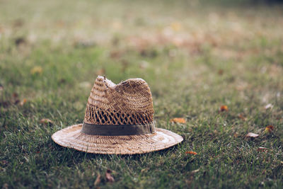 Close-up of hat on field