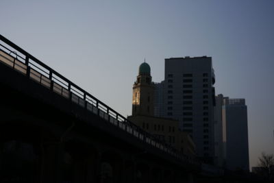 Low angle view of buildings against sky at dusk