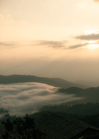 Scenic view of mountains against sky during sunset