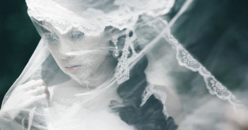Close-up of young bride in veil