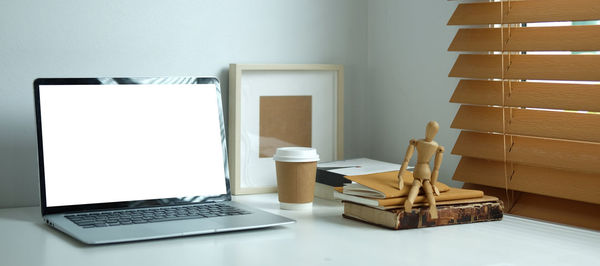 View of laptop and equipment on table