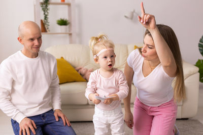 Portrait of siblings sitting at home