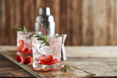 Close-up of drinks on wooden table