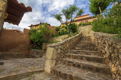 Staircase of old building against sky
