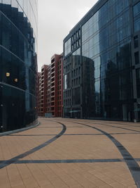 Modern buildings in city against sky