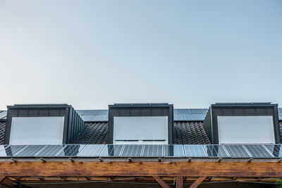 Low angle view of buildings against clear sky