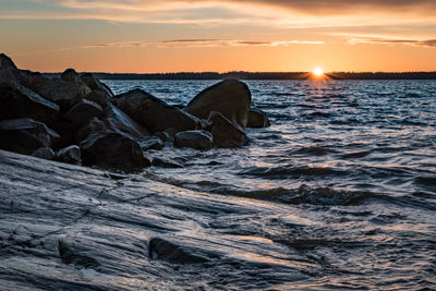 Scenic view of sea against sky during sunset