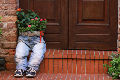 Low section of man wearing flower shoes