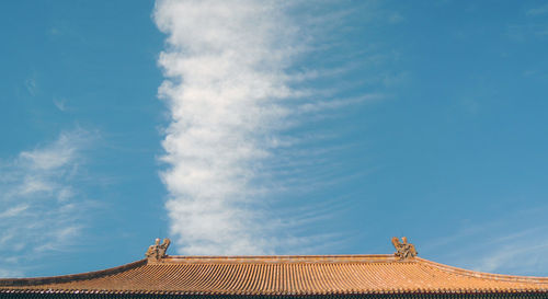 Low angle view of roof against sky