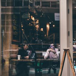 People sitting in restaurant at night