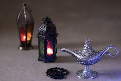 Close-up of illuminated lighting equipment on table