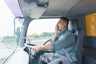 Man sitting in car