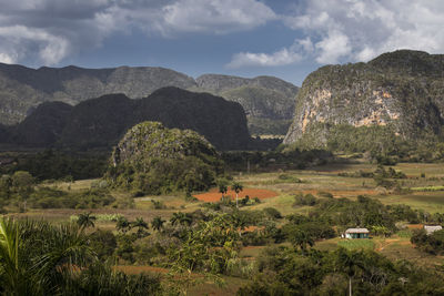 Scenic view of landscape and mountains against sky