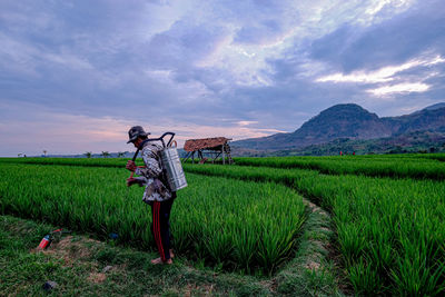 Full length of man standing in farm